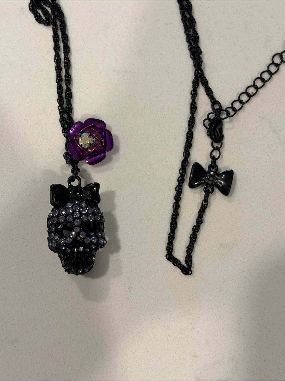 Betsey Johnson Black Crystal Skull Necklace with Purple Flower Charm